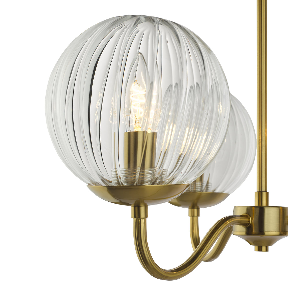Close up of a brass chandelier with three ribbed glass globes