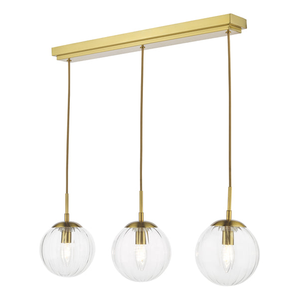 Three clear ribbed glass globe pendant lights with brass accents and a rectangular brass ceiling bar