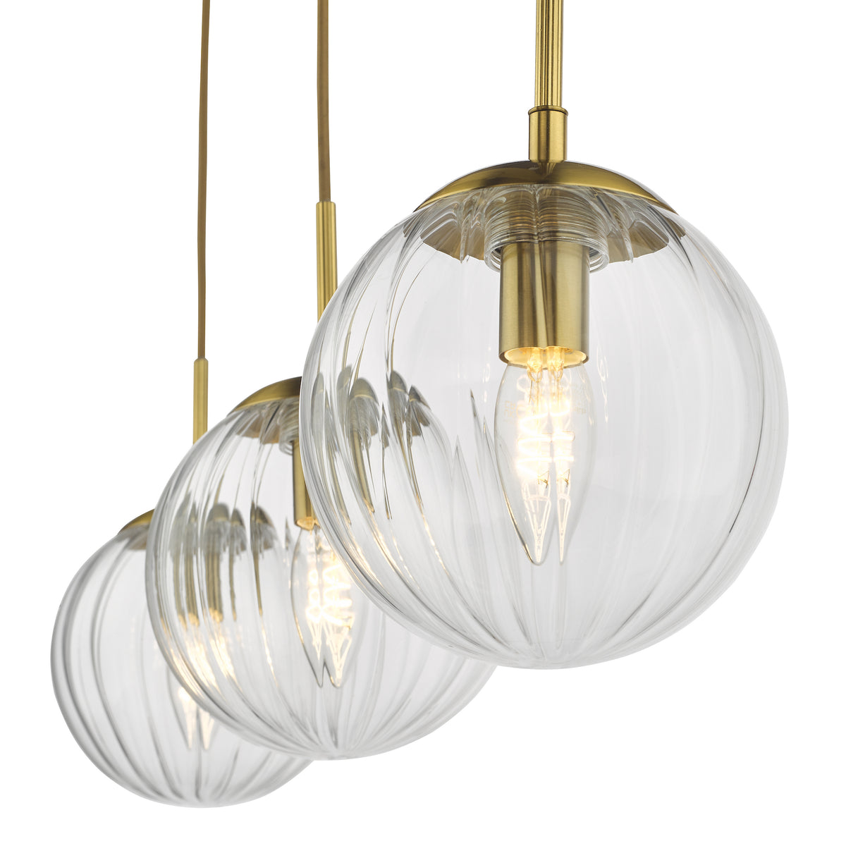 Three clear glass pendant lights with brass fittings and visible filaments, hanging in a row