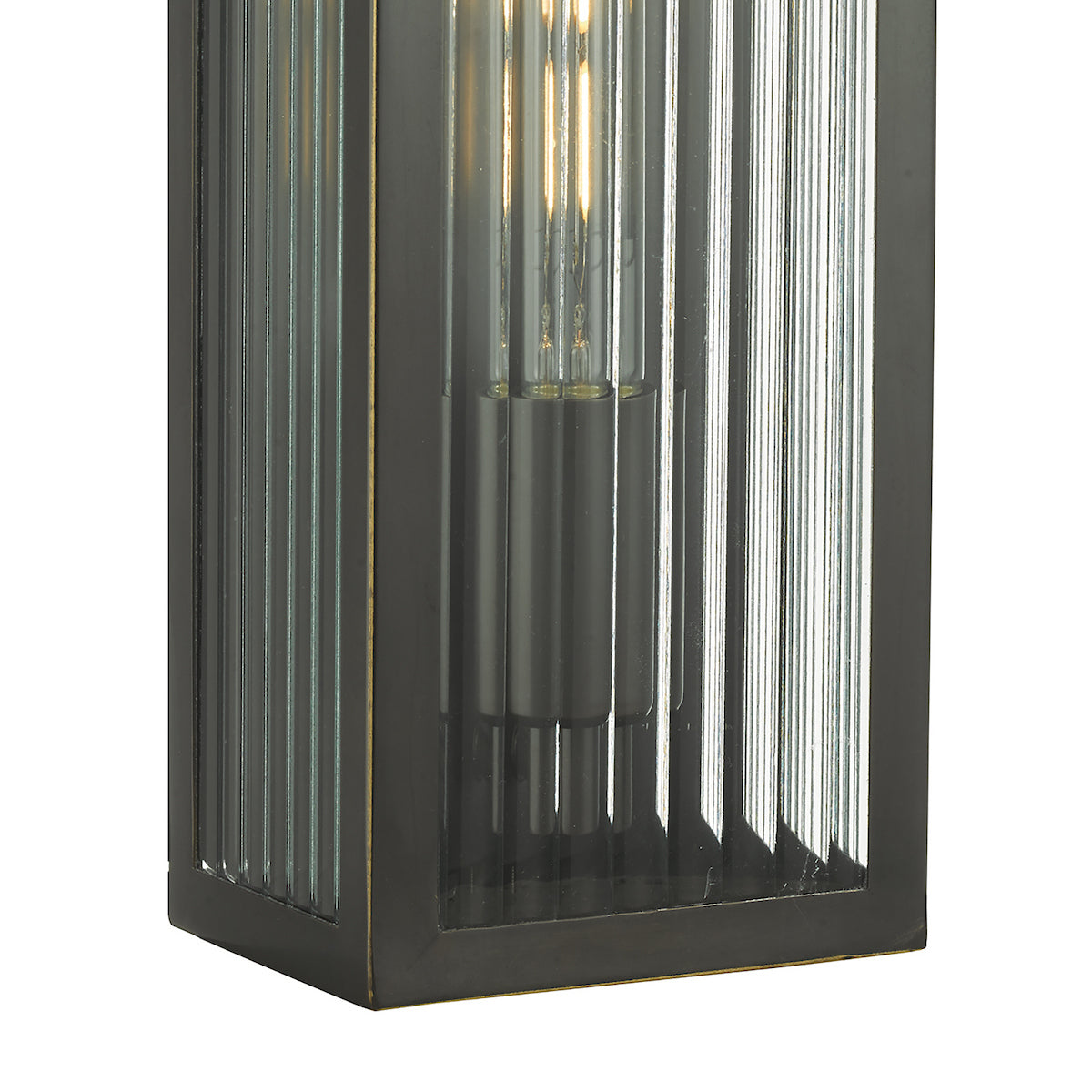 Close up of a dark bronze outdoor wall light with fluted glass