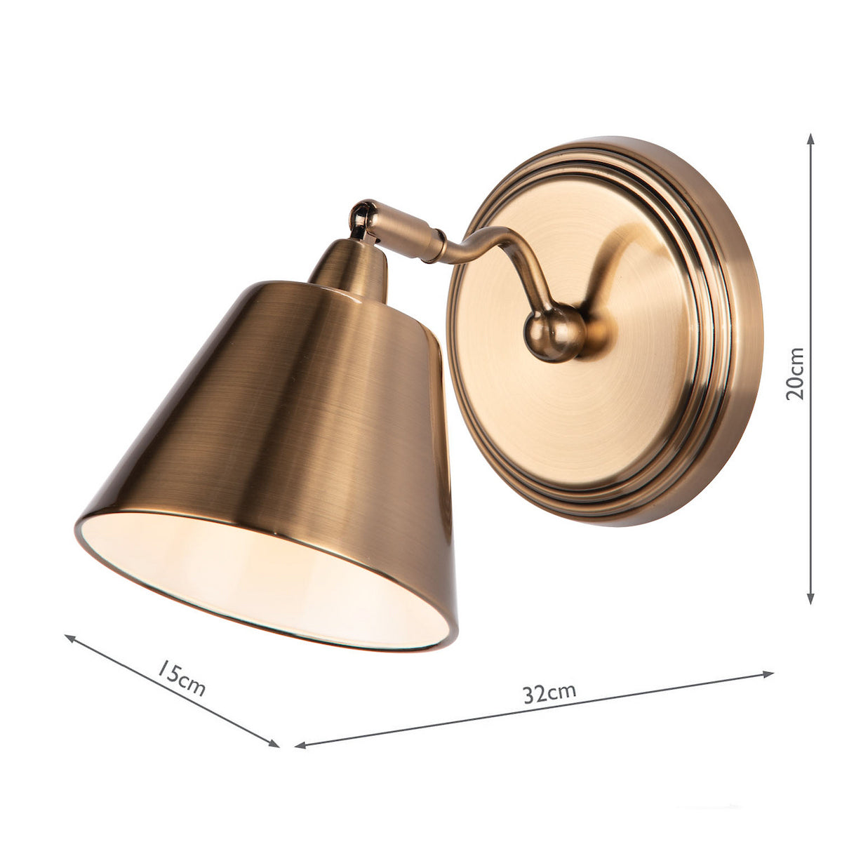Antique brass wall light with a conical shade and round base, dimensions 20cm high, 32cm deep, 15cm shade width