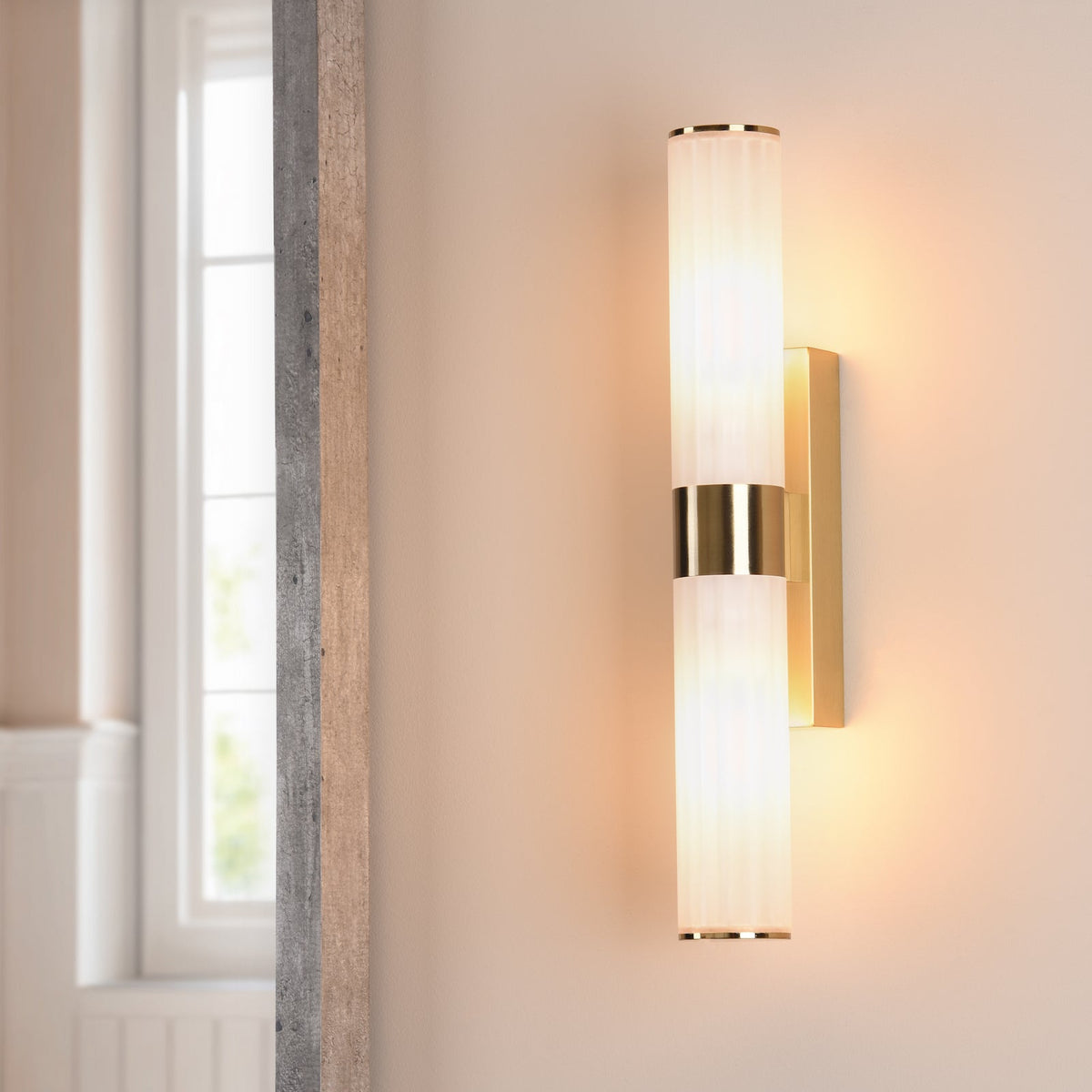 Brass wall light with two ribbed glass shades