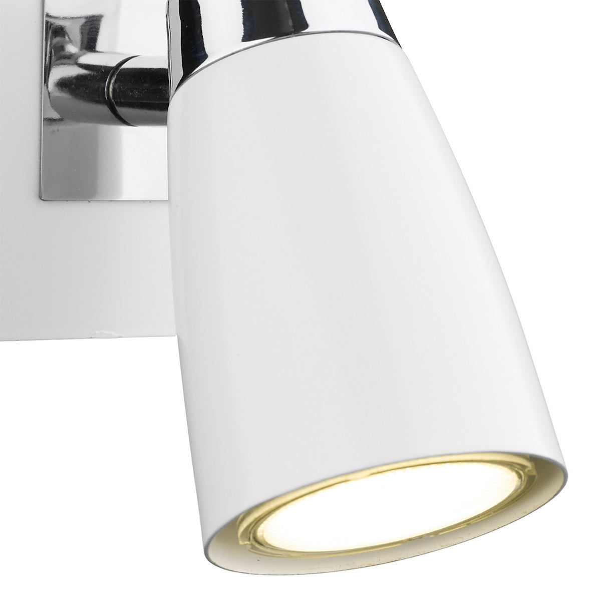White wall-mounted spotlight with a chrome base and warm light glowing from the bulb.