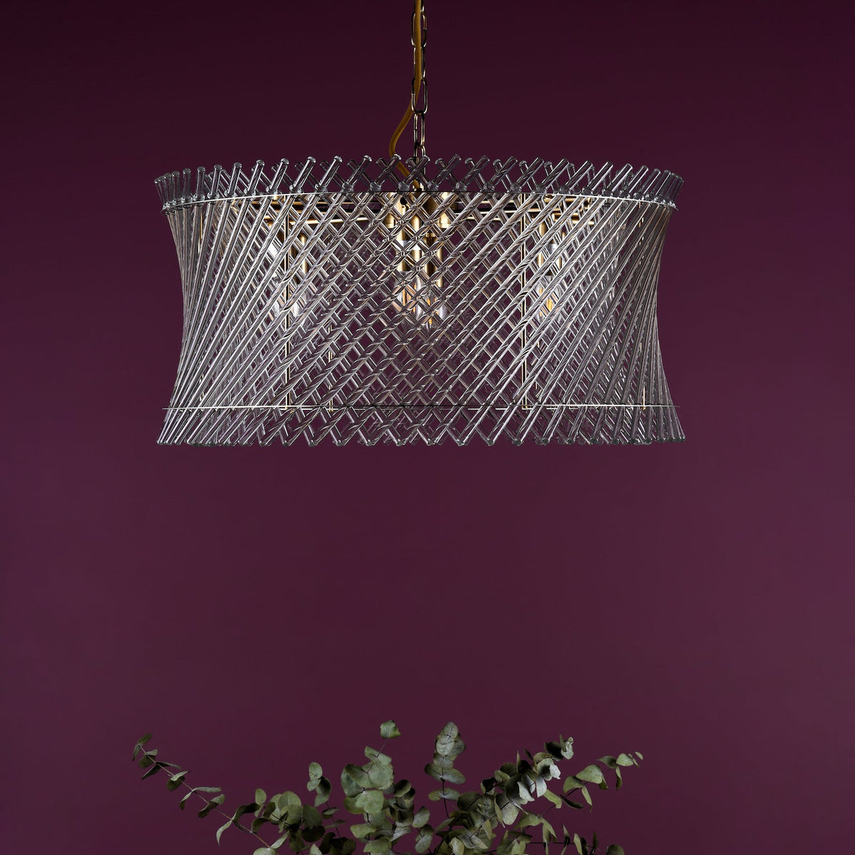 Clear glass pendant light with a twisted design
