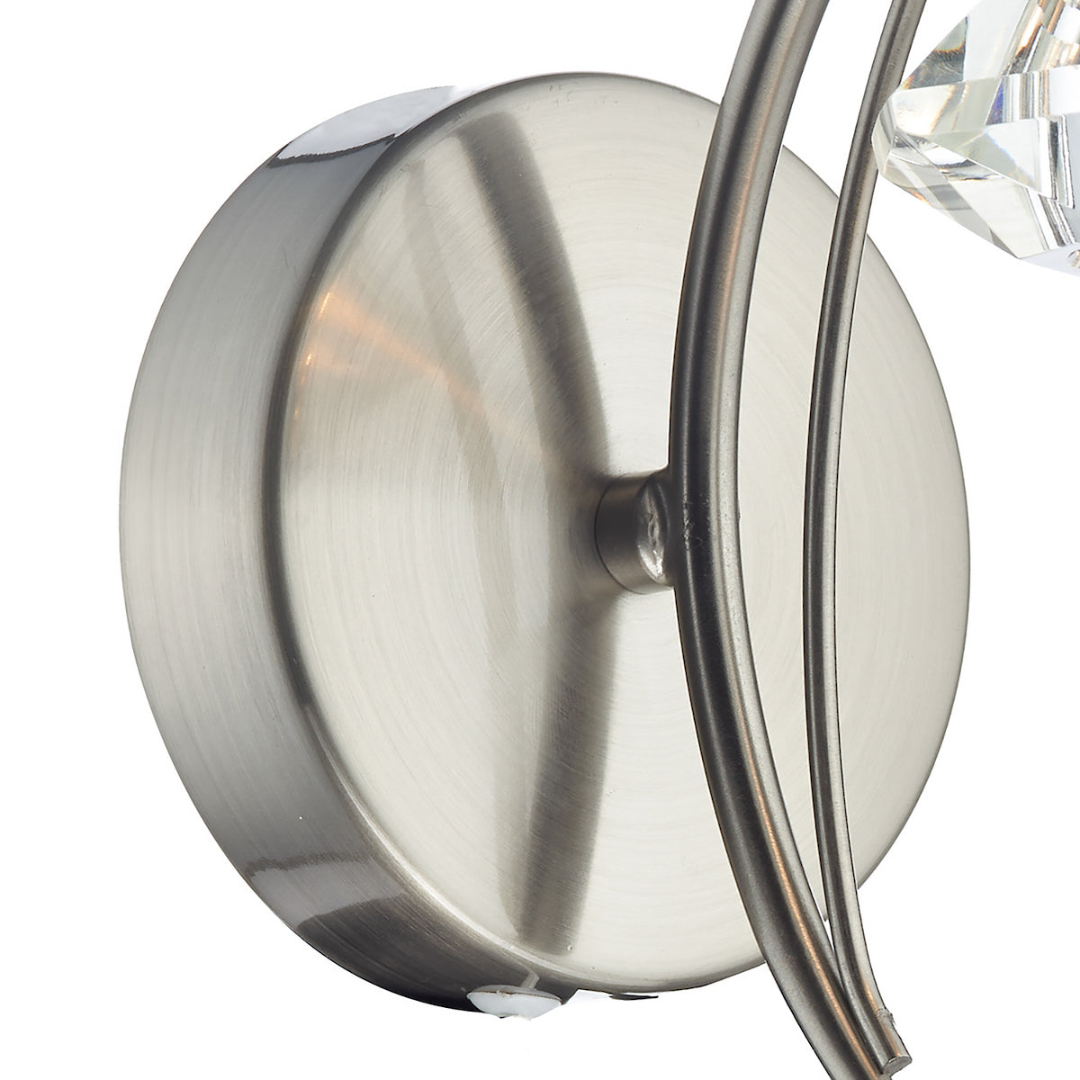Brushed nickel wall light with curved arms and crystal accents.