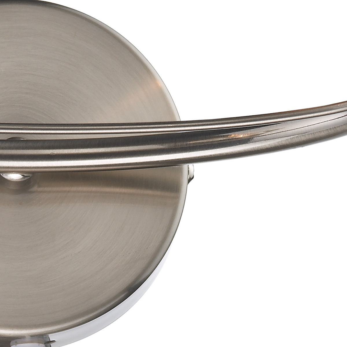 Close-up of a brushed nickel light fixture with a curved arm.