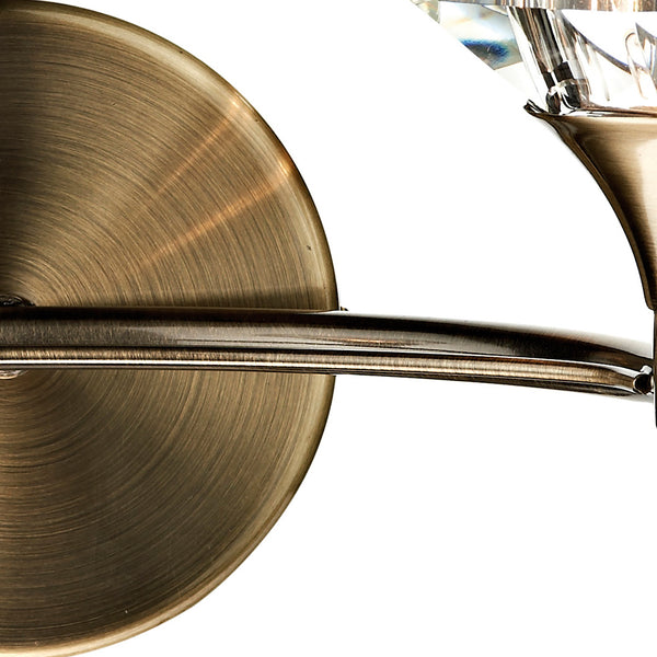 Close-up of a bronze wall sconce with a crystal accent.