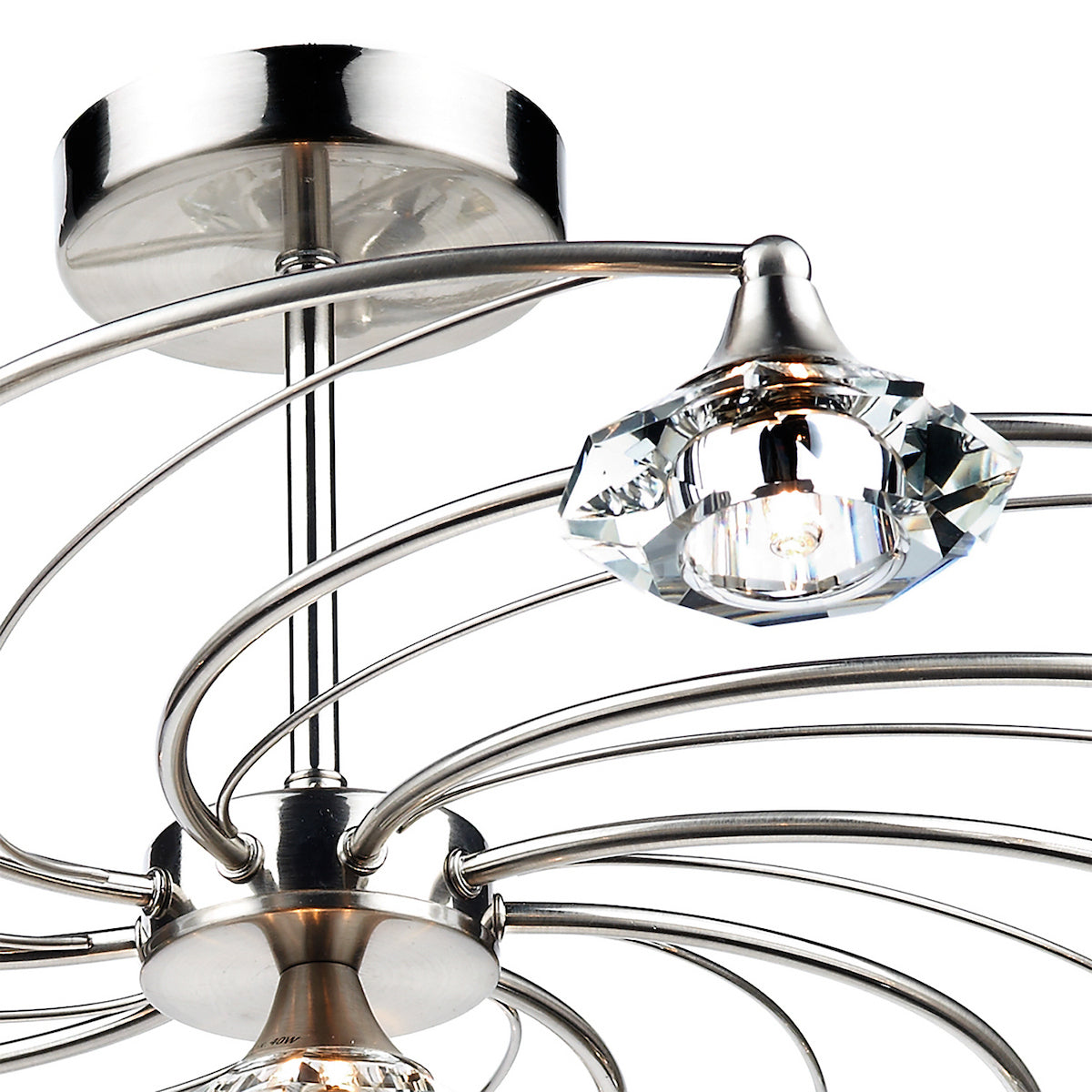 Close-up of a modern chrome ceiling light with crystal accents and curved arms.