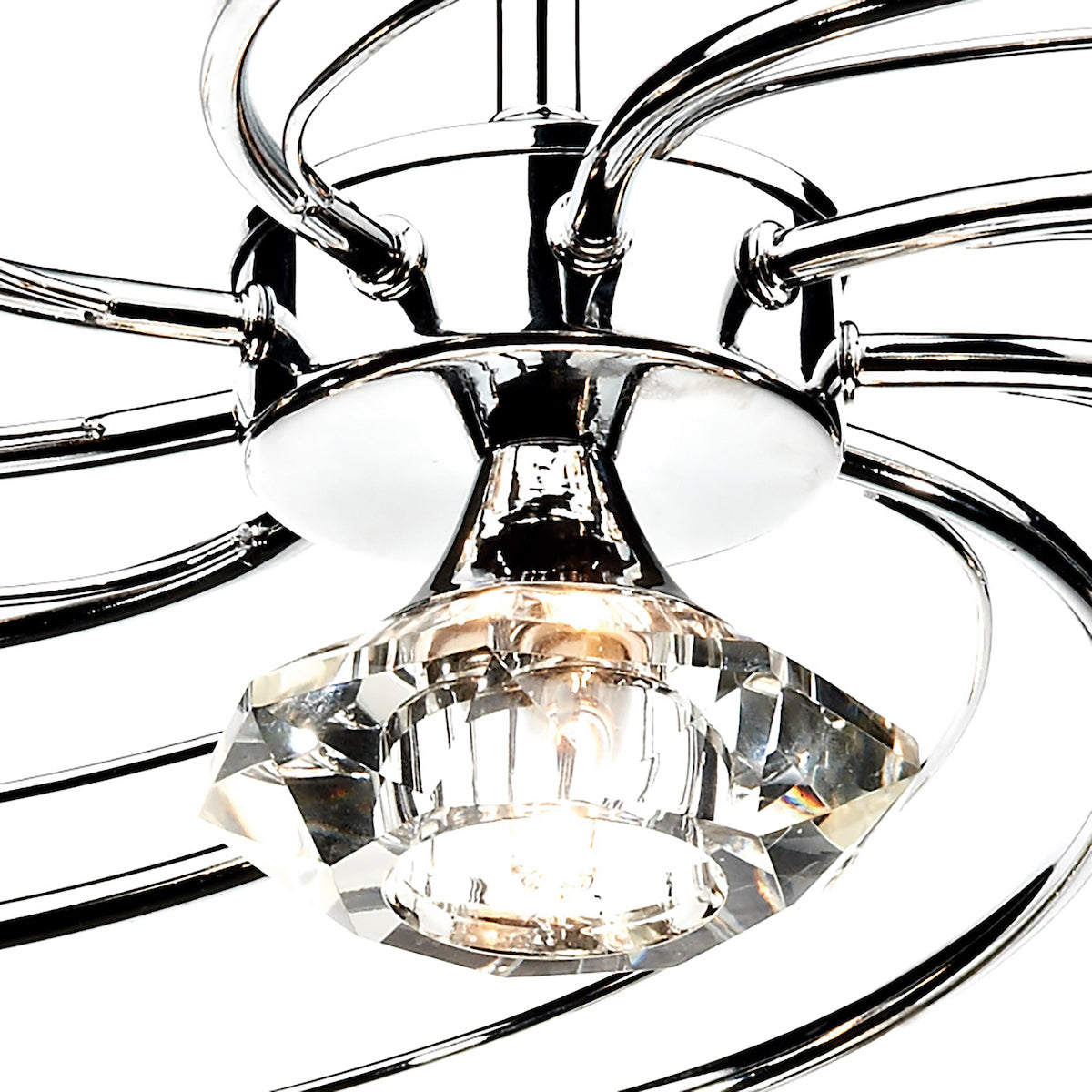 Close-up of a modern chrome chandelier with a faceted crystal light fixture.