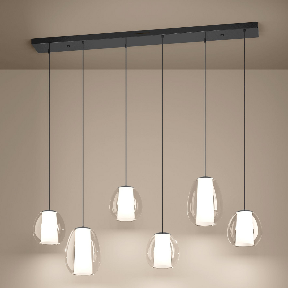 Six clear glass pendant lights with white cylindrical diffusers hang from a black rectangular ceiling fixture