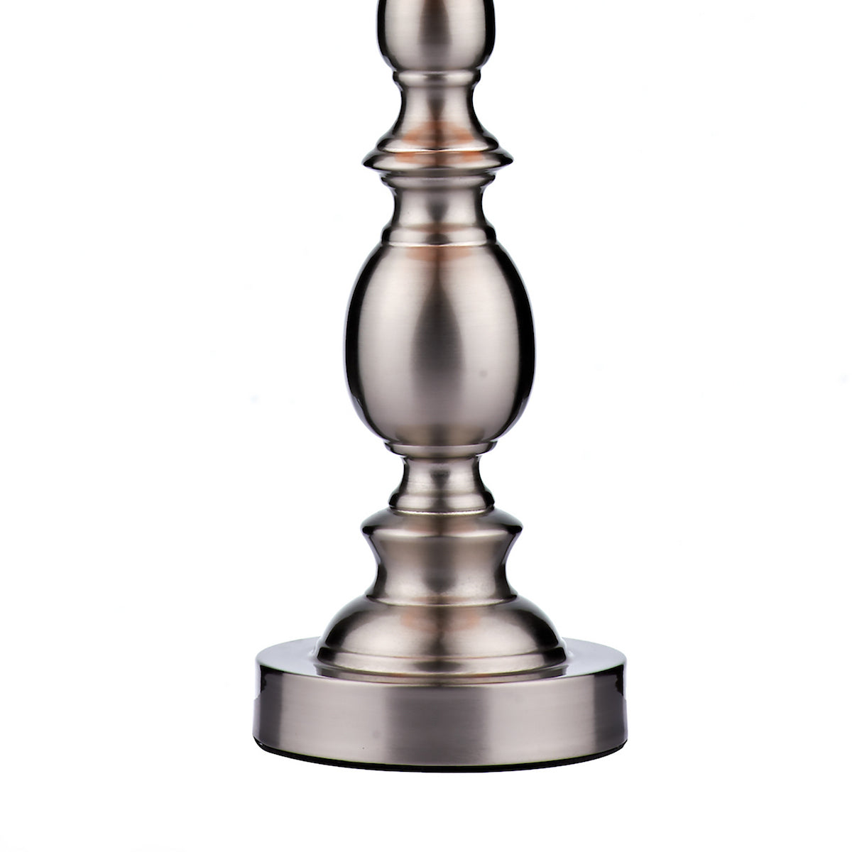 Close-up of a brushed nickel lamp base with an ornate, curved design.