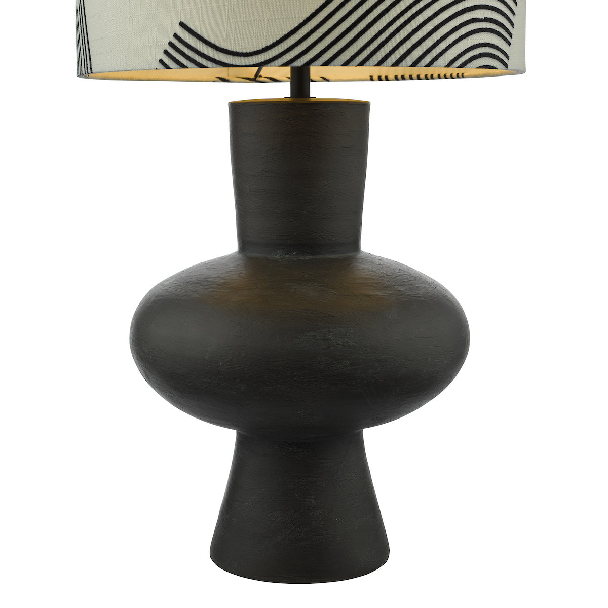Black sculptural table lamp with a white shade featuring black abstract lines.