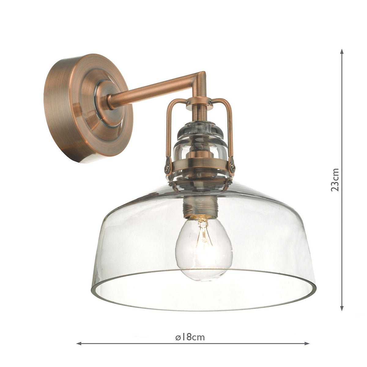 A vintage-style wall light with a clear glass shade and a copper-colored metal fixture. It measures 23cm high and 18cm wide.