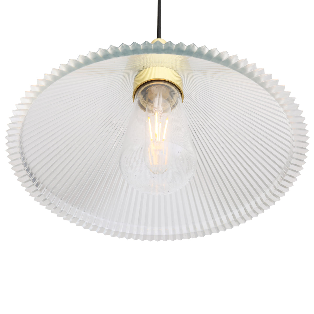 Clear ribbed glass pendant light with brass hardware and exposed filament bulb
