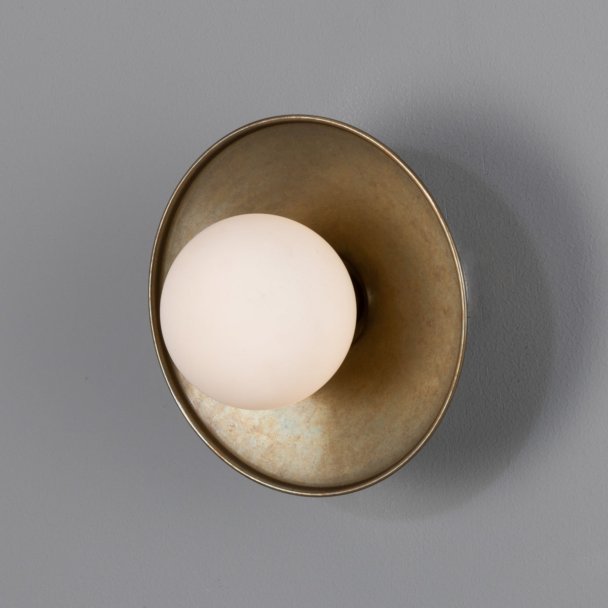 Aosta IP65 Brass Disc Bathroom Wall Light in Antique Brass with Opal Glass Globe