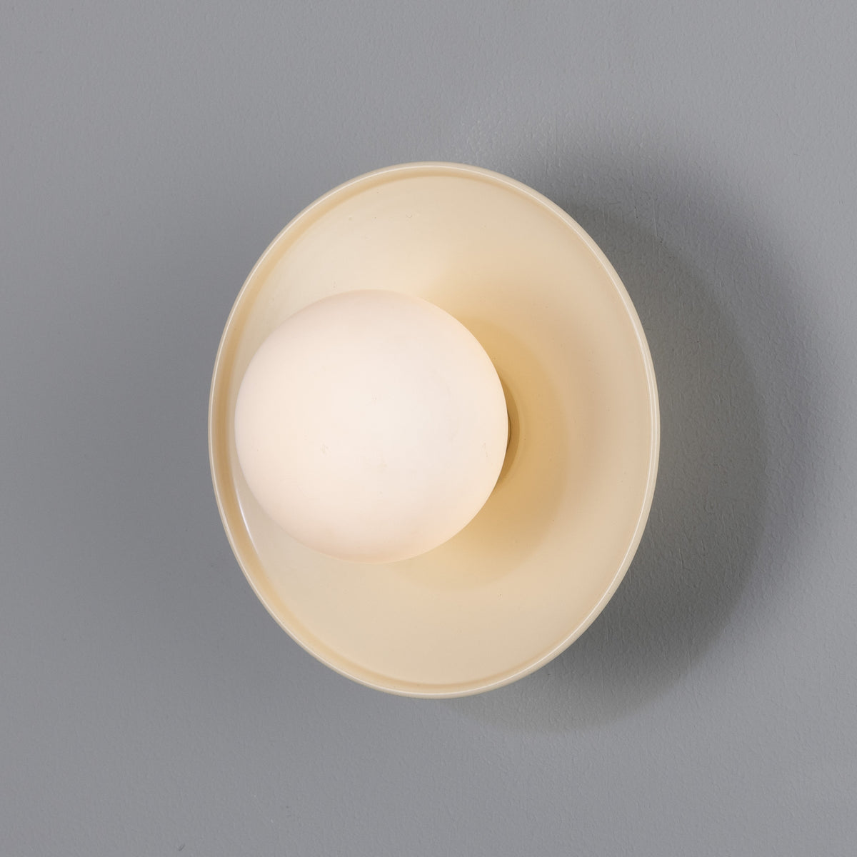 Aosta IP65 Brass Disc Bathroom Wall Light in Vanilla Cream with Opal Glass Globe