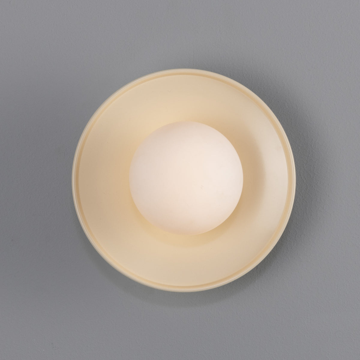 Aosta IP65 Brass Disc Bathroom Wall Light in Vanilla Cream with Opal Glass Globe