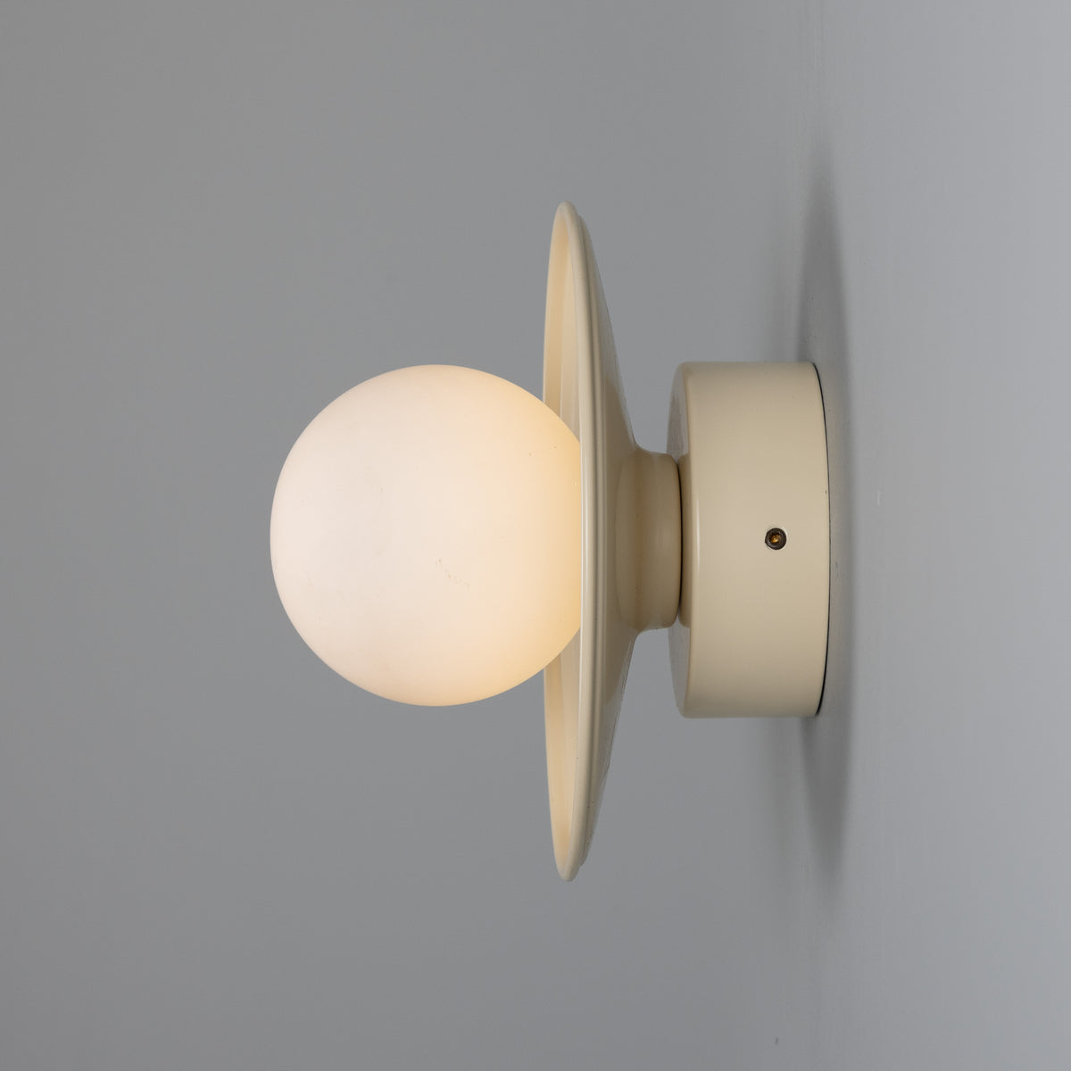 Aosta IP65 Brass Disc Bathroom Wall Light in Vanilla Cream with Opal Glass Globe