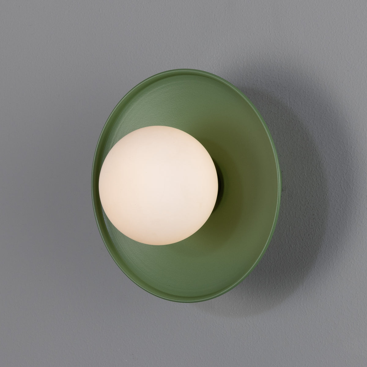 Aosta IP65 Brass Disc Bathroom Wall Light in Sage Green with Opal Glass Globe