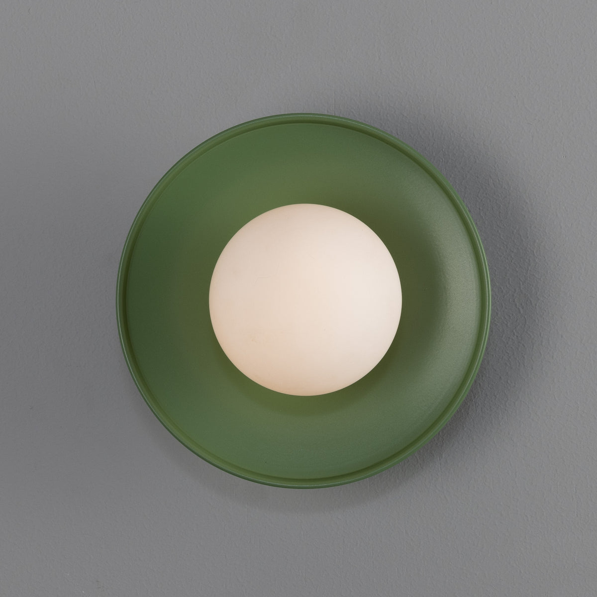 Aosta IP65 Brass Disc Bathroom Wall Light in Sage Green with Opal Glass Globe