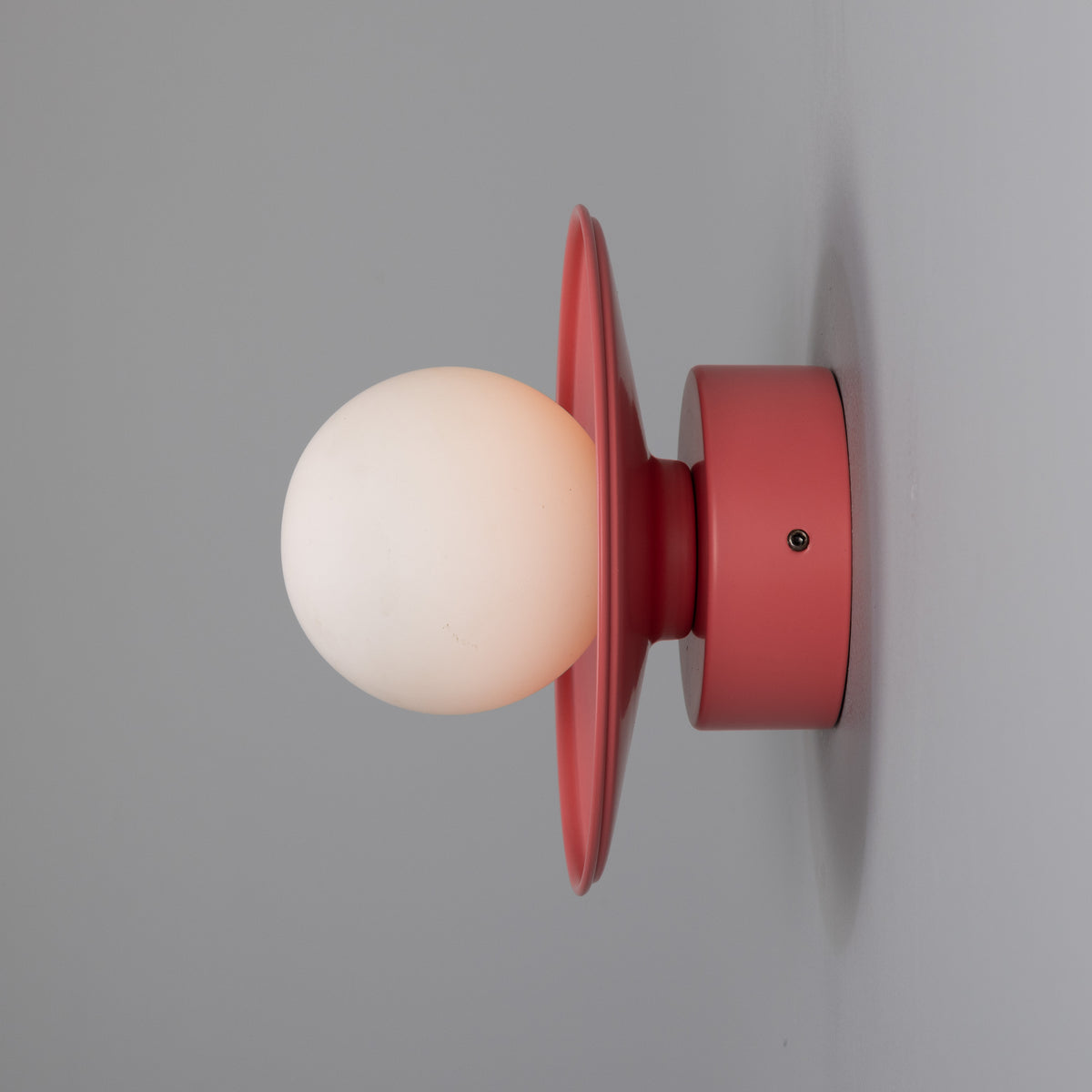 Aosta IP65 Brass Disc Bathroom Wall Light in Antique Pink with Opal Glass Globe