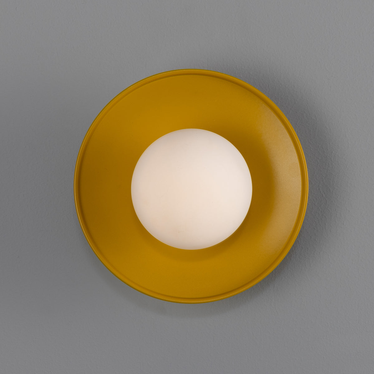 Aosta IP65 Brass Disc Bathroom Wall Light in Honey Yellow with Opal Glass Globe
