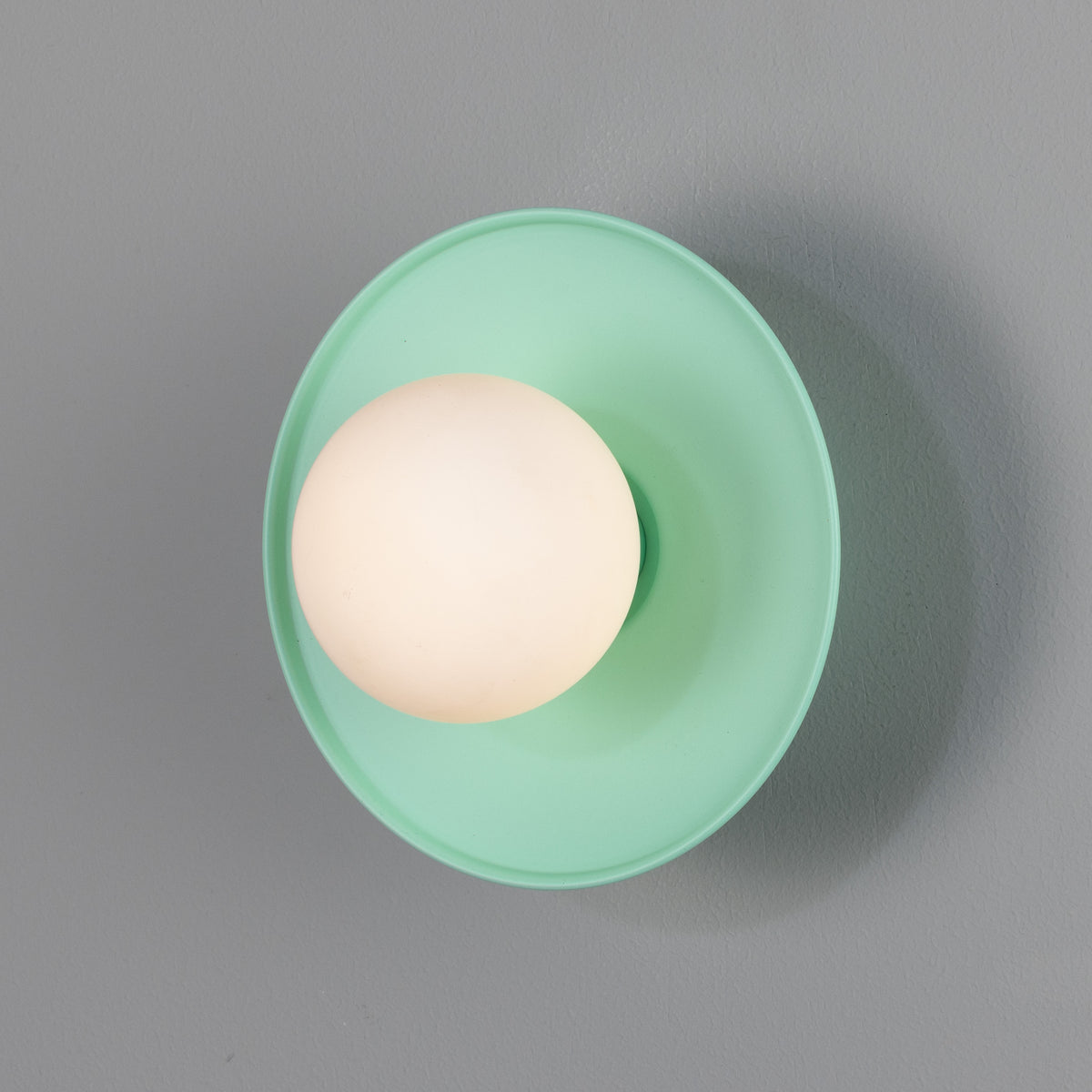 Aosta IP65 Brass Disc Bathroom Wall Light in Mint Turquoise with Opal Glass Globe