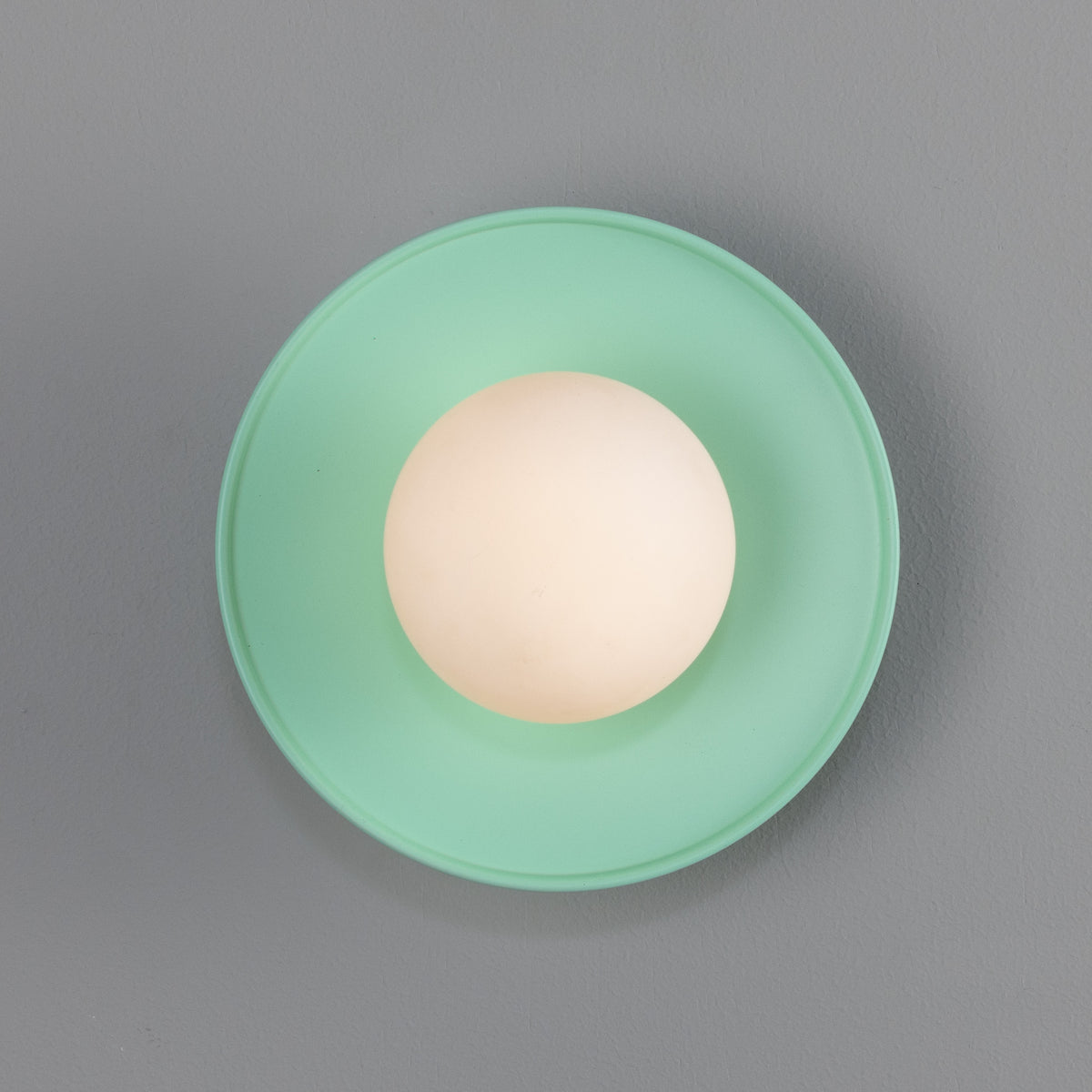 Aosta IP65 Brass Disc Bathroom Wall Light in Mint Turquoise with Opal Glass Globe