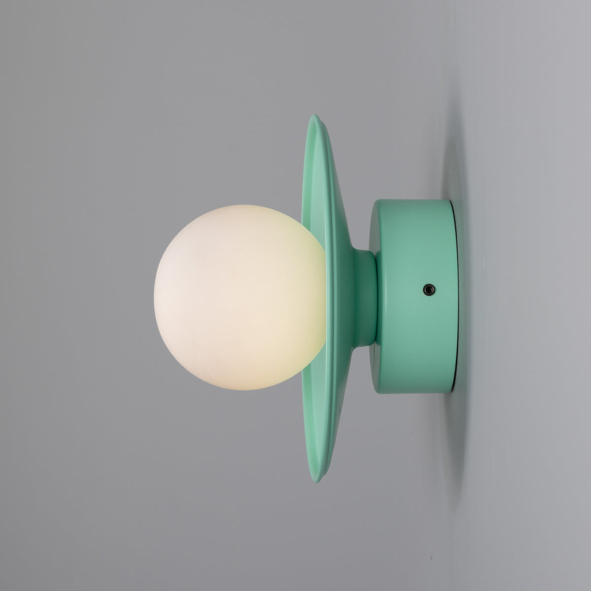 Mullan Aosta mint turquoise brass disc wall light with opal glass globe