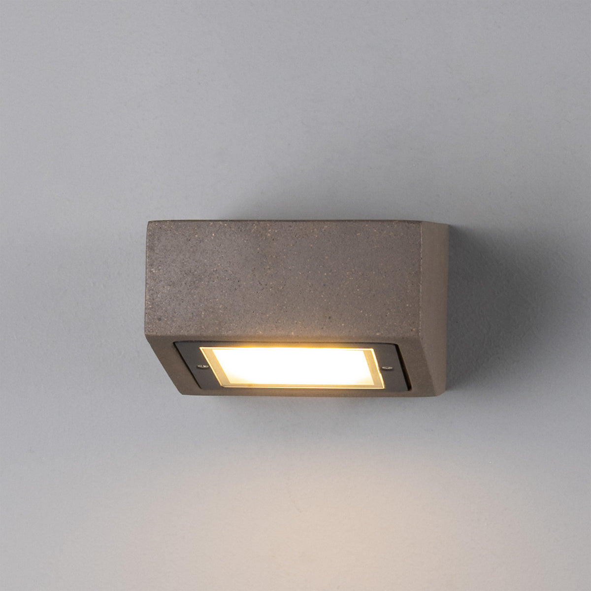 Mullan Trieste IP65 exterior concrete LED wall light mounted on a grey wall