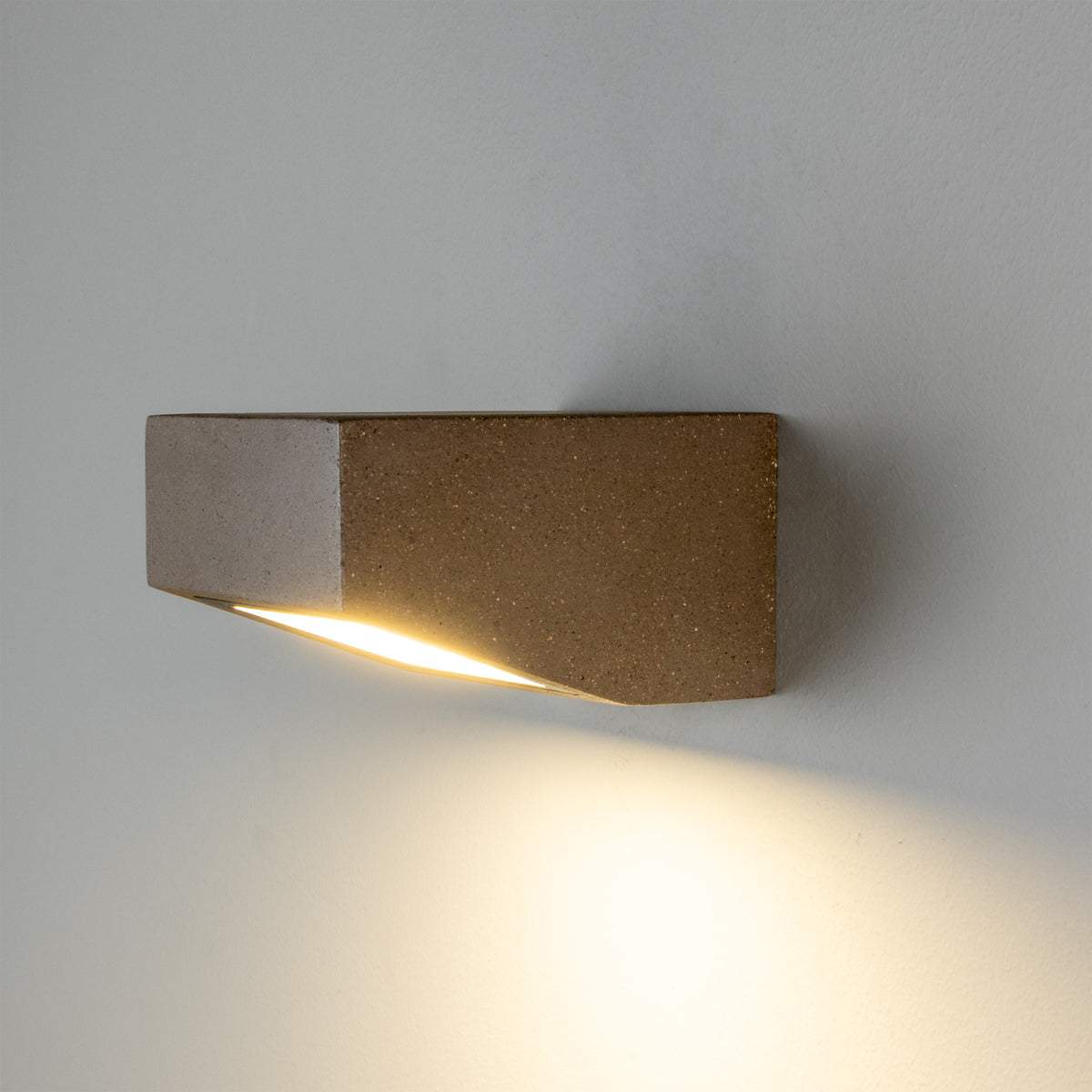 Mullan Trieste IP65 exterior concrete LED wall light mounted on a wall casting light downwards