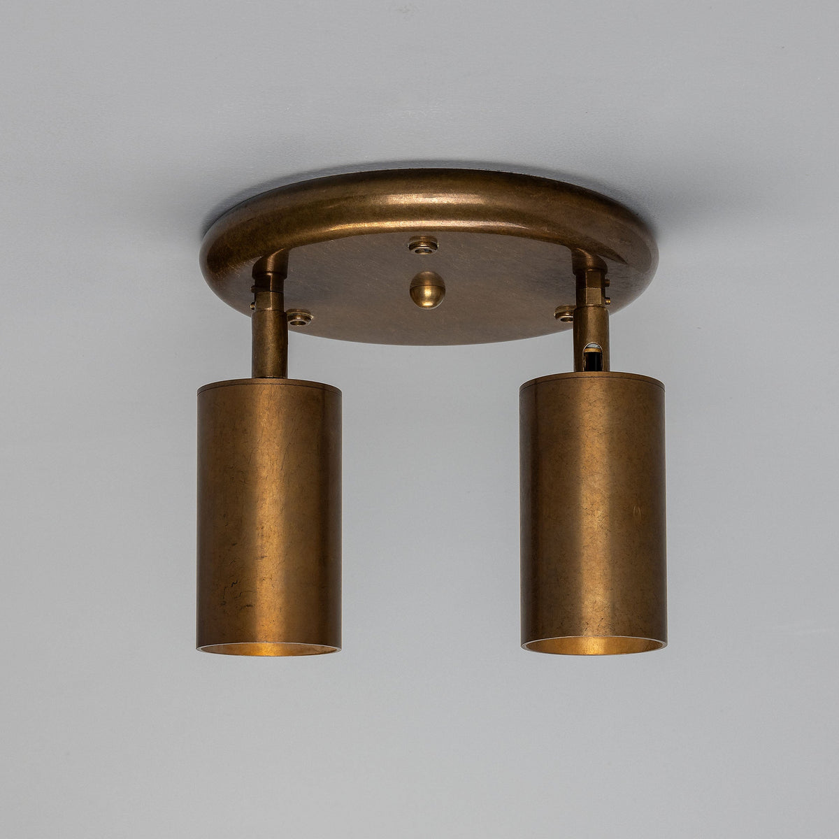 Mullan Evanston two light directional brass ceiling spotlight in antique brass