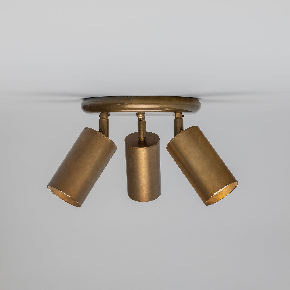 Evanston Three Light Directional Brass Ceiling Spotlight in Antique Brass
