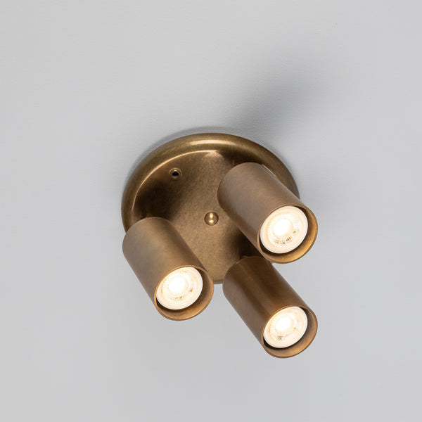 Evanston Three Light Directional Brass Ceiling Spotlight in Antique Brass