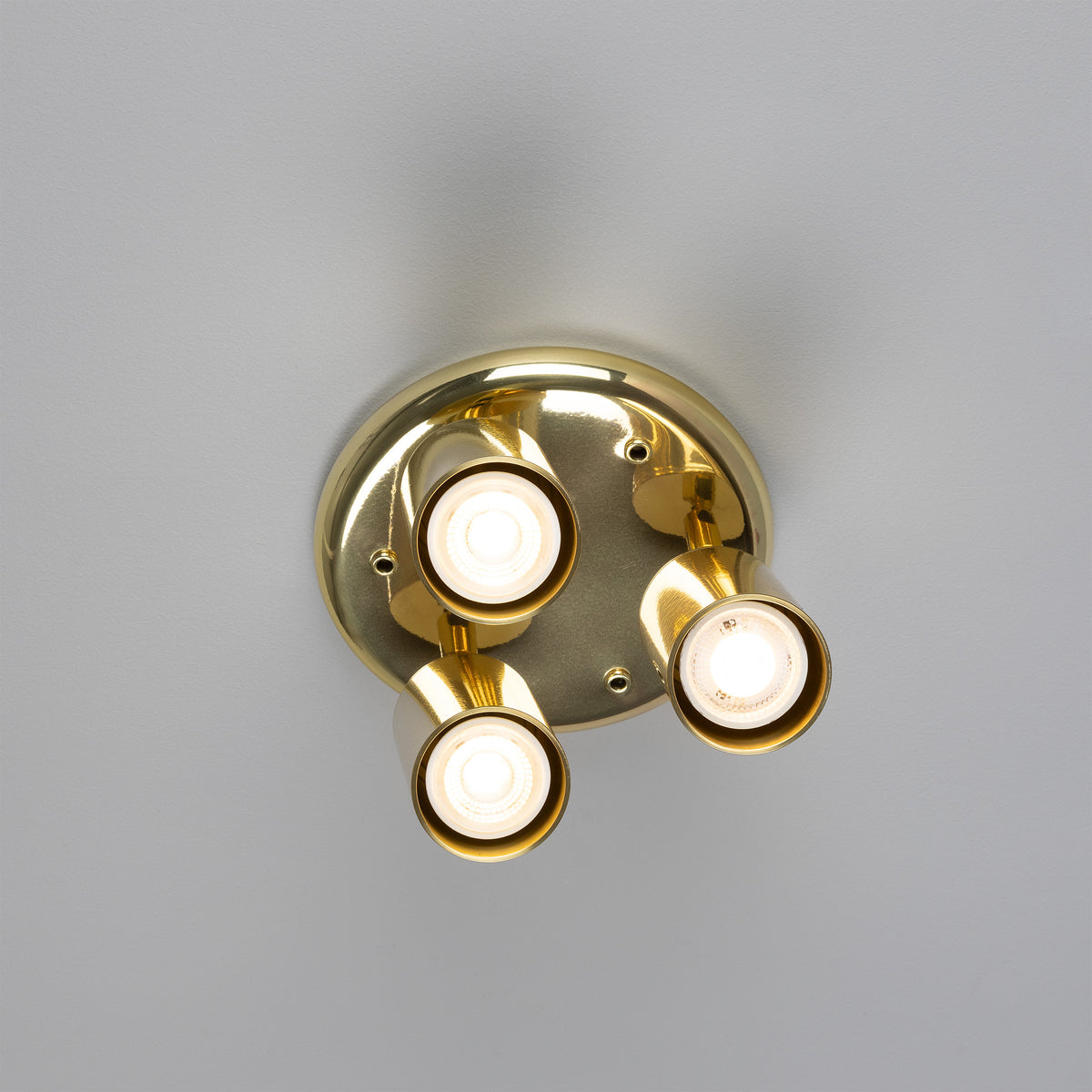 Mullan Evanston three light directional brass ceiling spotlight in polished brass