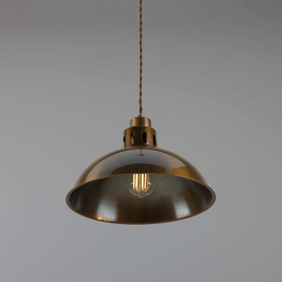 Antique brass dome pendant light with exposed filament bulb