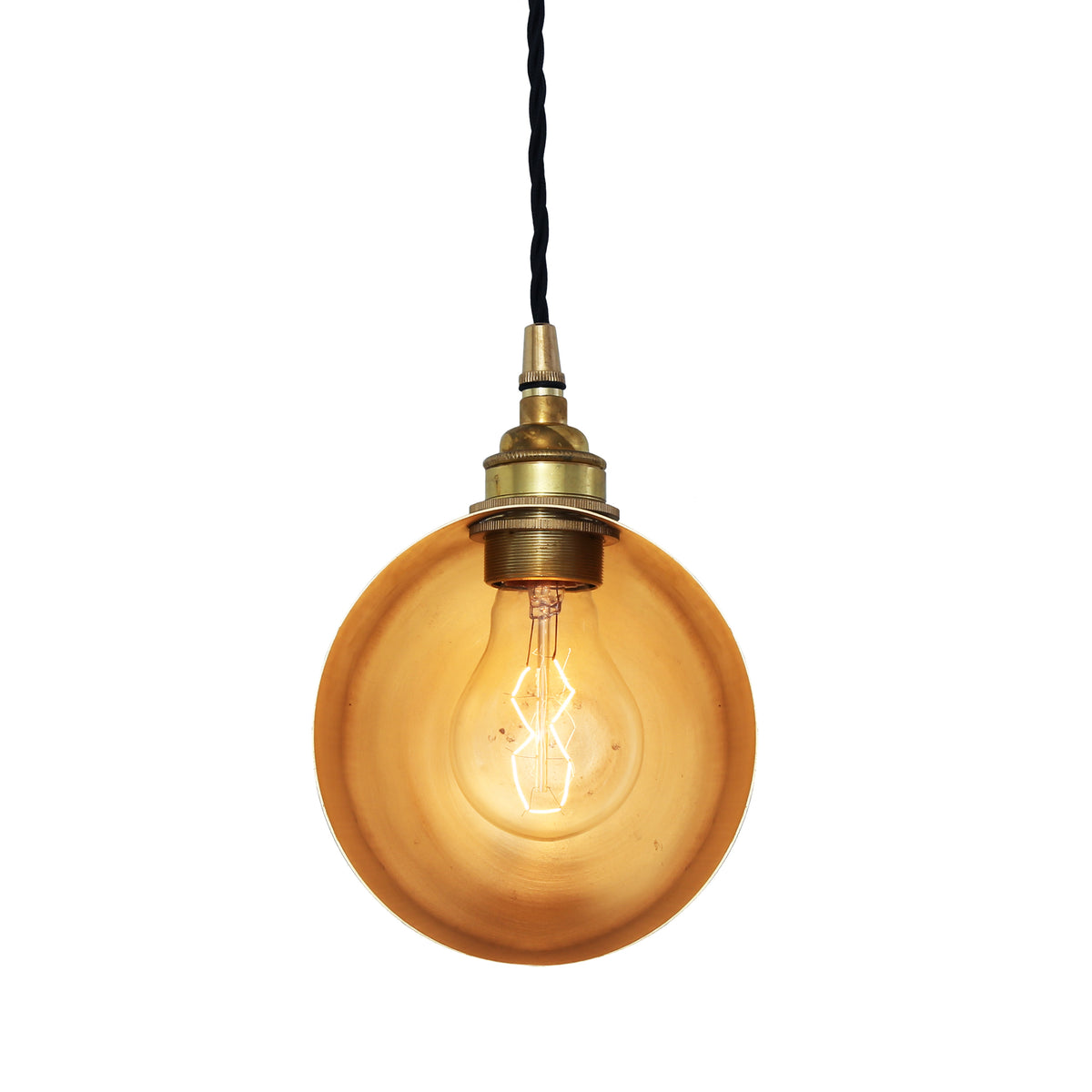 Brass pendant light with exposed filament bulb and black fabric cord
