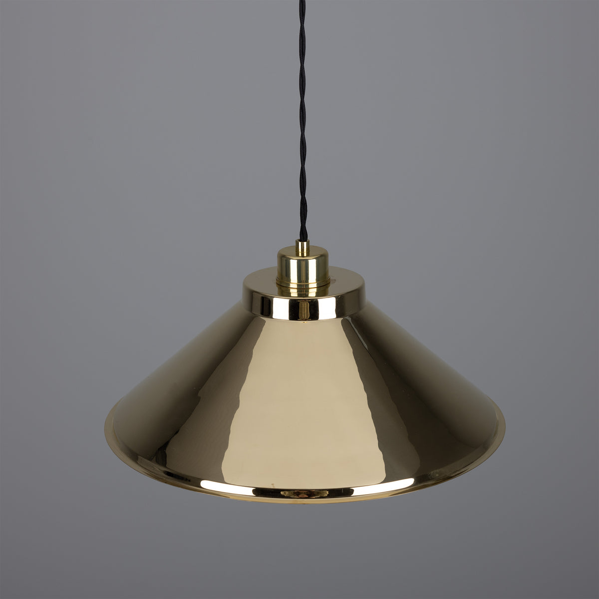 Polished brass conical pendant light with black fabric cord