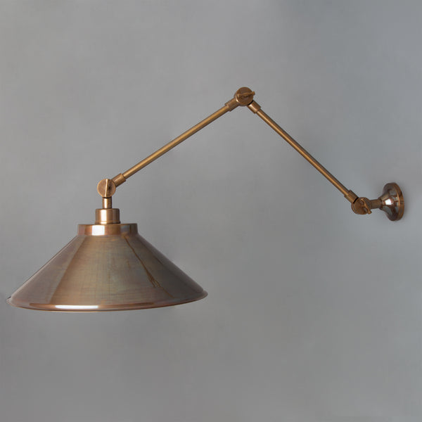 Rio Adjustable Arm Wall Light in Antique Brass