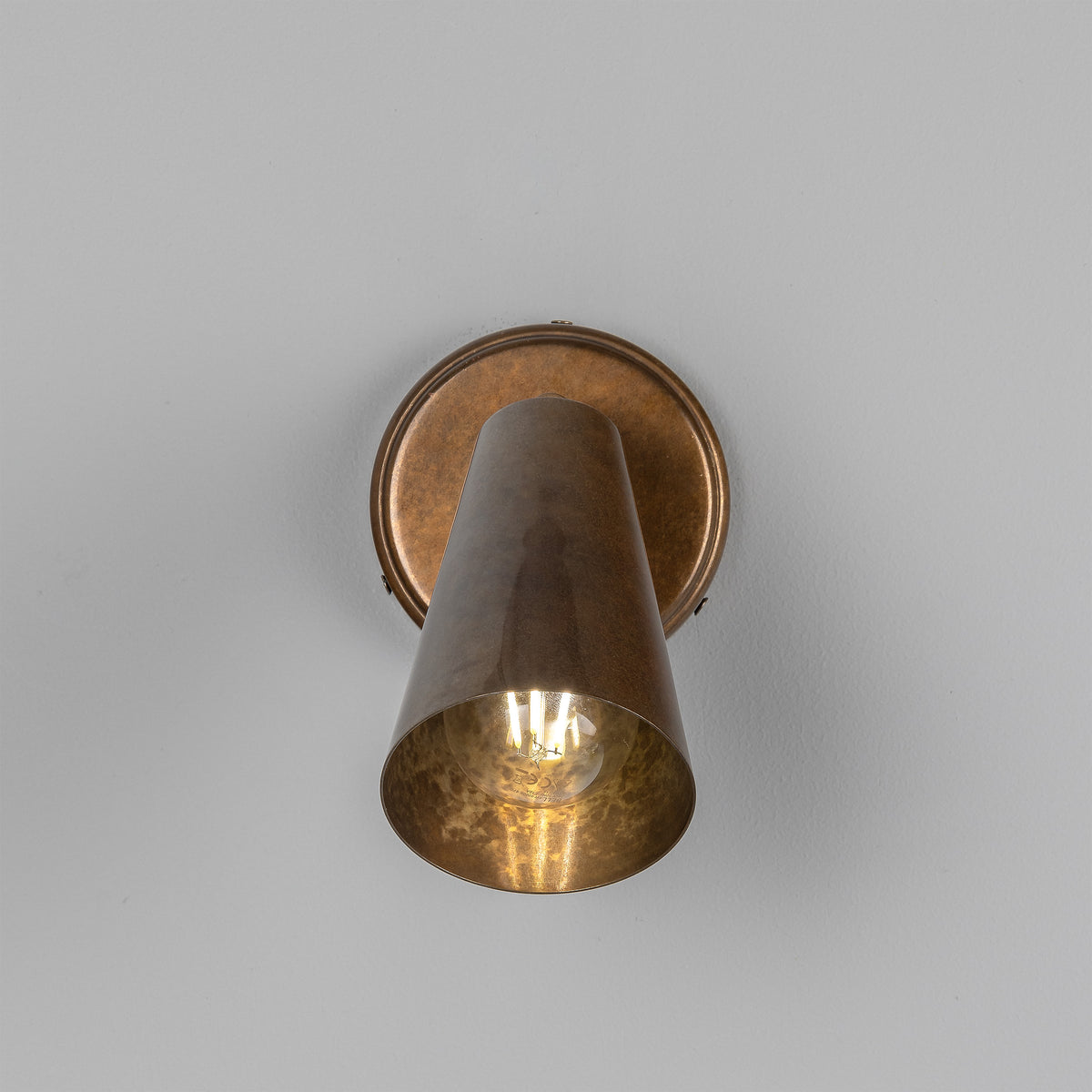 Cashel Adjustable Switched Brass Cone Wall Light in Antique Brass