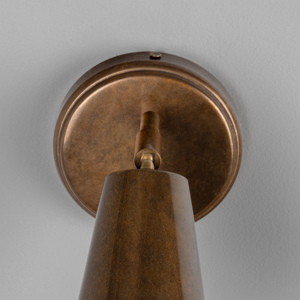 Cashel Adjustable Switched Brass Cone Wall Light in Antique Brass