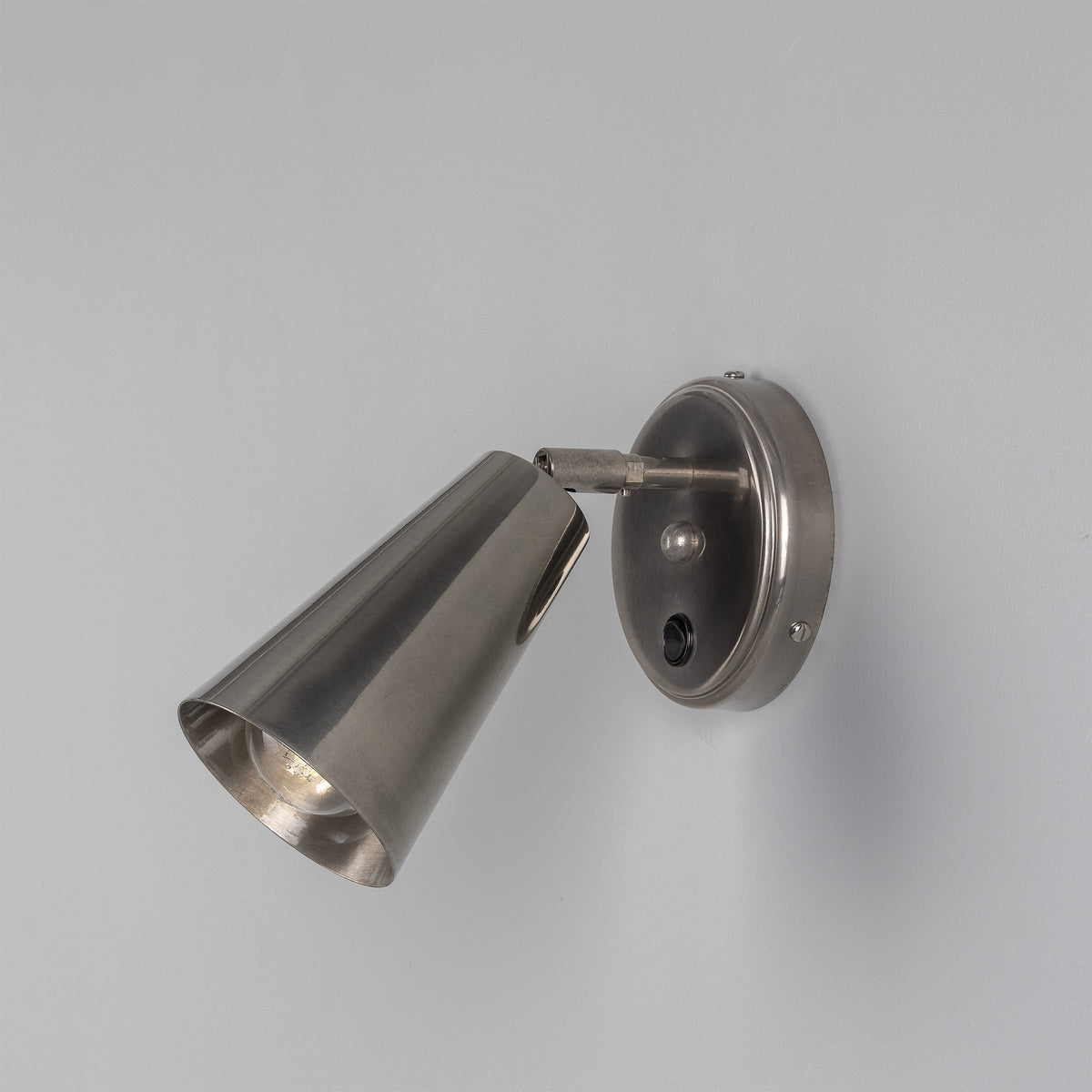 Cashel Adjustable Switched Brass Cone Wall Light in Antique Silver