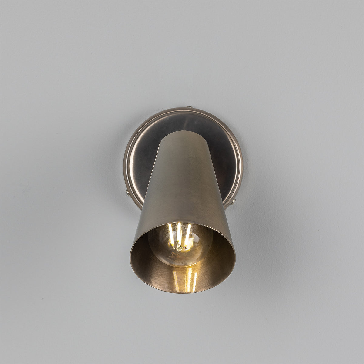 Cashel Adjustable Switched Brass Cone Wall Light in Antique Silver