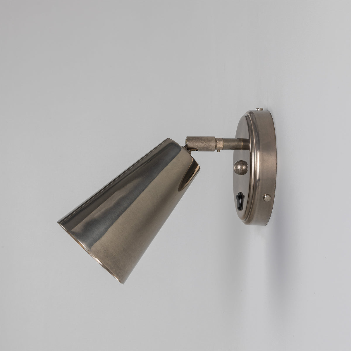 Cashel Adjustable Switched Brass Cone Wall Light in Antique Silver