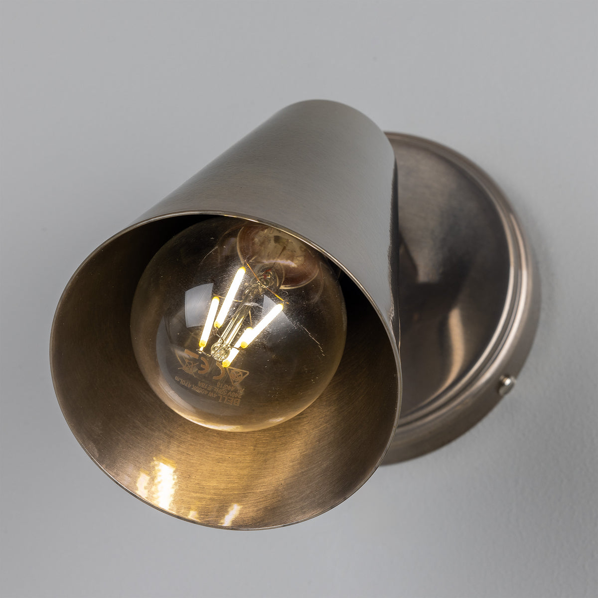 Cashel Adjustable Switched Brass Cone Wall Light in Antique Silver