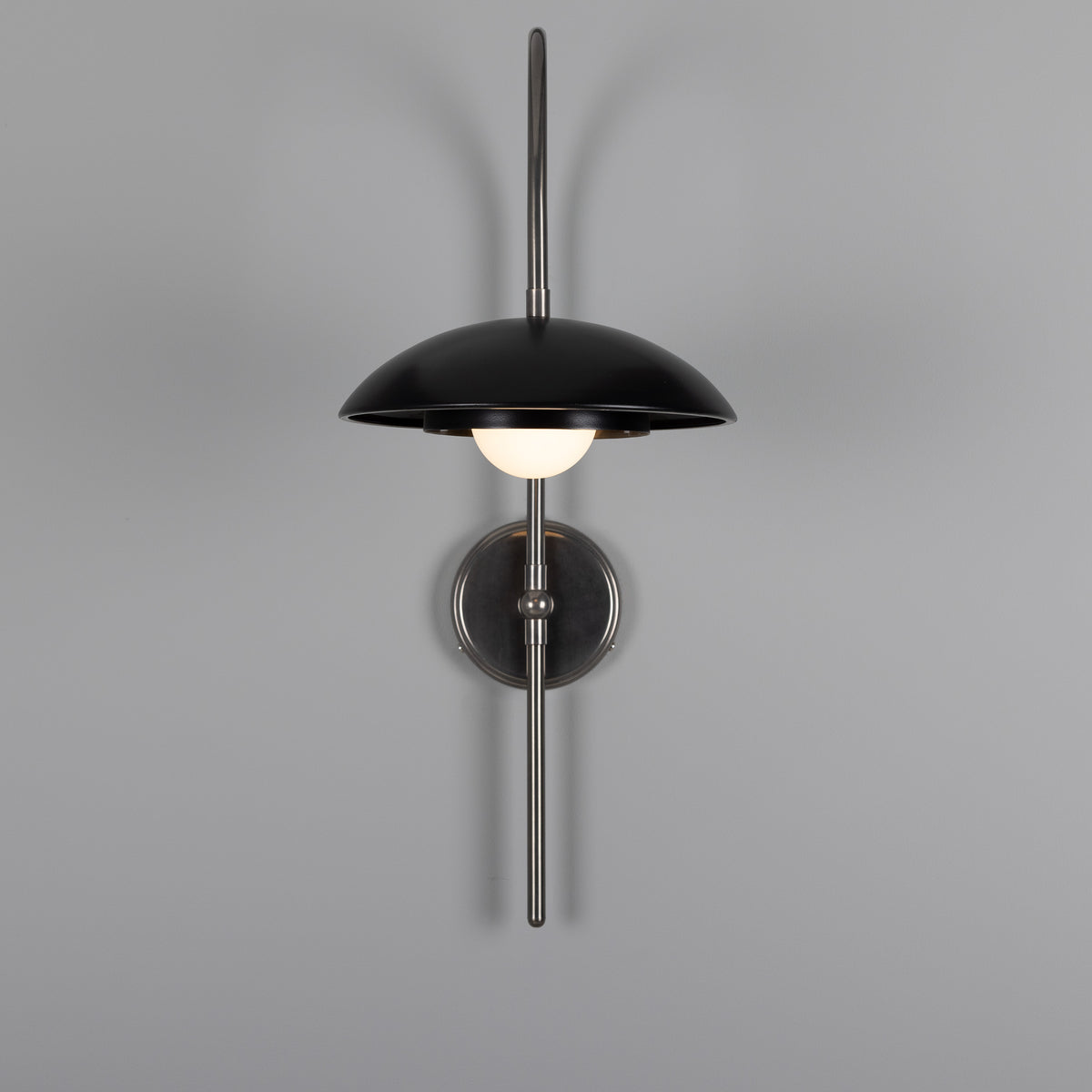Mullan Marrakesh Art Deco arc wall light in antique silver and matte black with a central globe bulb