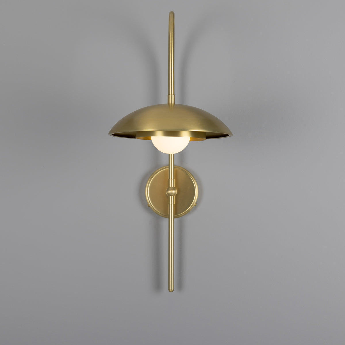 Mullan Marrakesh Art Deco Arc wall light in satin brass with a dome shade and spherical bulb