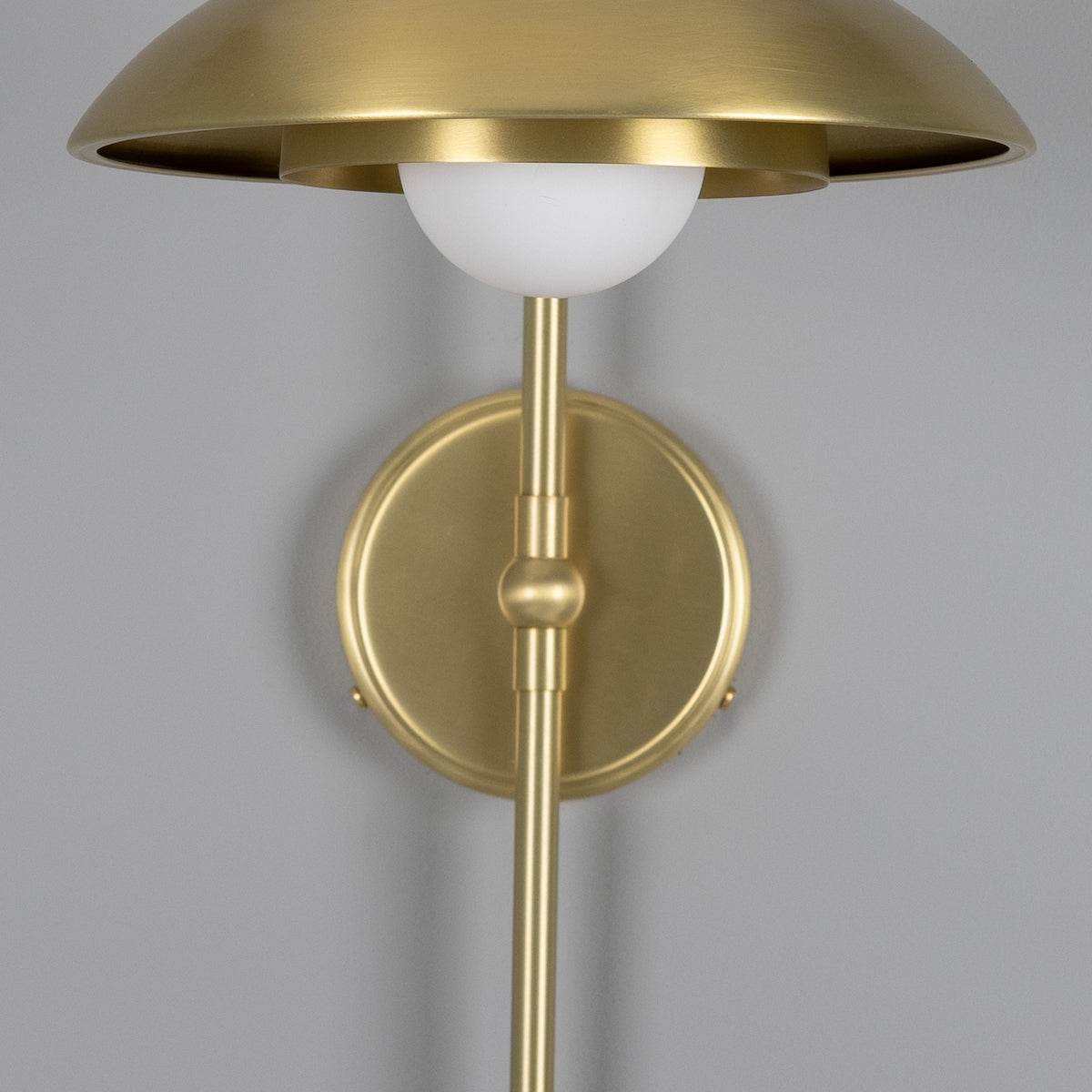 Mullan Marrakesh Art Deco arc wall light in satin brass with a white globe shade