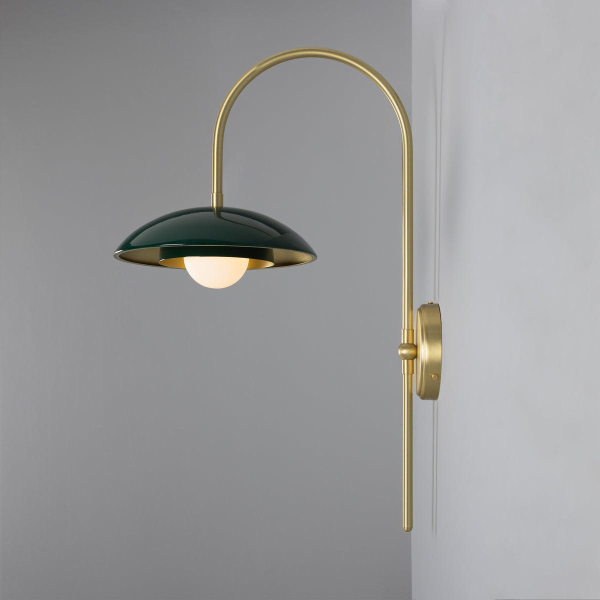 Mullan Marrakesh Art Deco arc wall light in satin brass and racing green with a round bulb