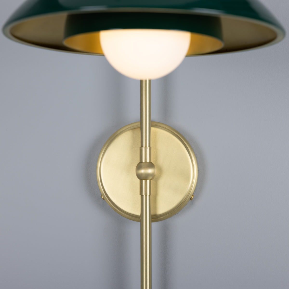Mullan Marrakesh Art Deco arc wall light in satin brass and racing green with a spherical bulb